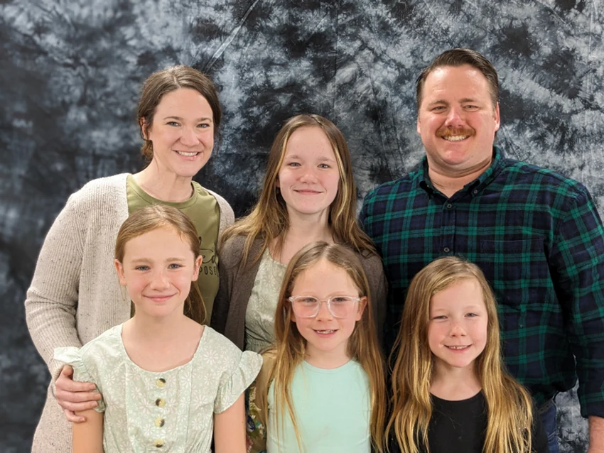 Chad and Kaitlin Francisco, facilities caretakers, pictured with others in the church's staff portrait.